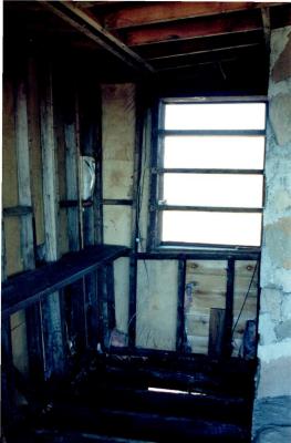View of Burned Floor Joists and Wall Studs, Retreat for Eleanor Oboler ("Eleanor's Retreat")